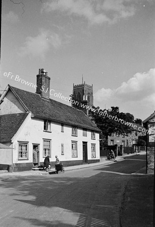 VILLAGE STREET WITH CHURCH TOWER